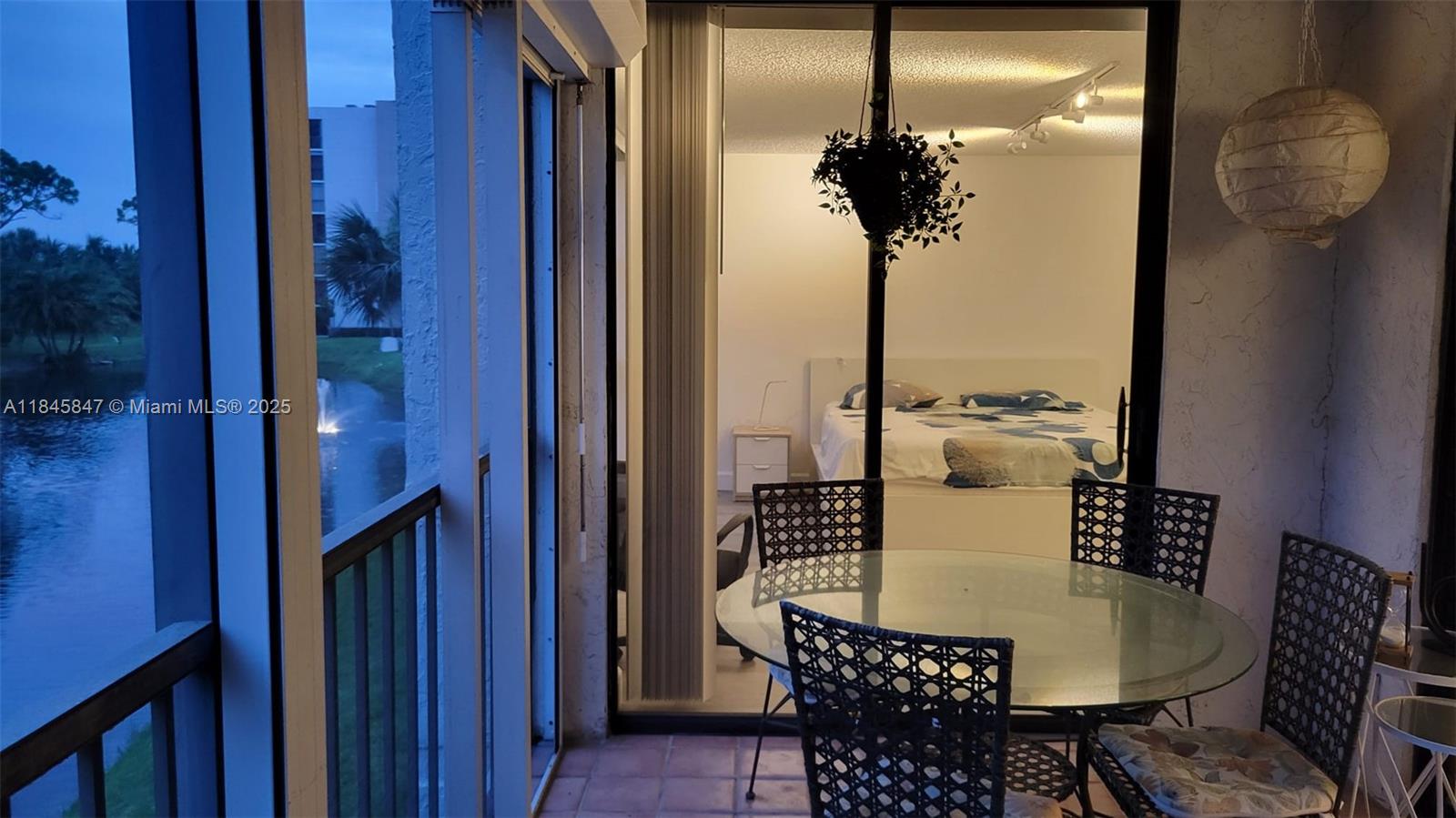 6562 Boca Del Mar Drive, Unit 225 Boca Raton, FL 33433 - Photo 24 of 24 a table and chairs in a balcony