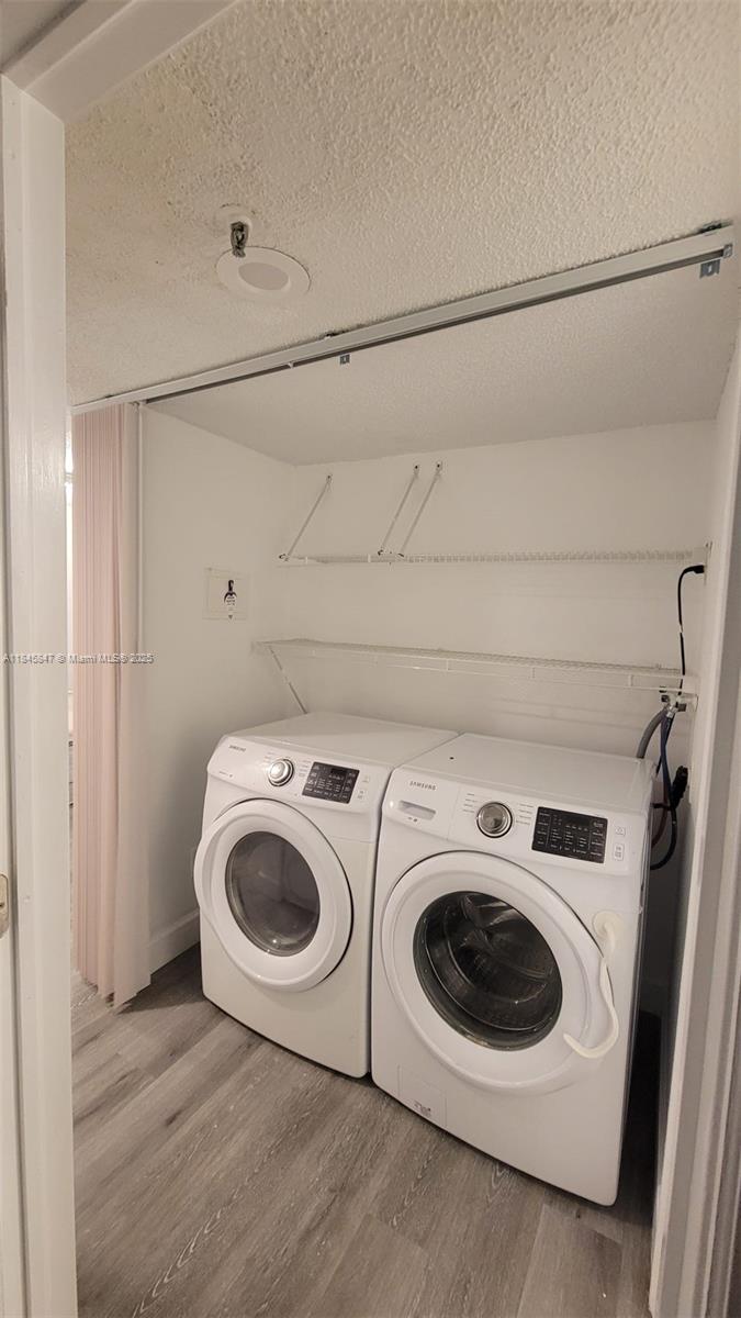 6562 Boca Del Mar Drive, Unit 225 Boca Raton, FL 33433 - Photo 10 of 24 a utility room with dryer and washer
