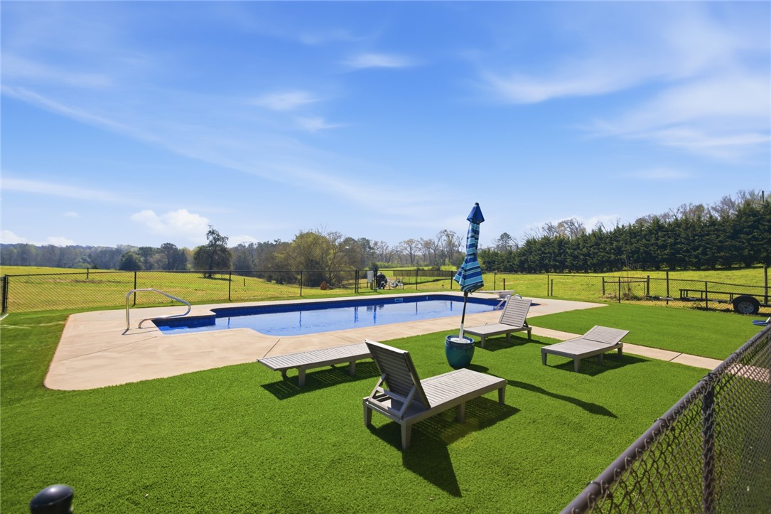 426 Oak Creek Road Seneca, SC 29678 - Photo 34 of 50 Enjoy leisurely days by the pool, surrounded by expansive green views.