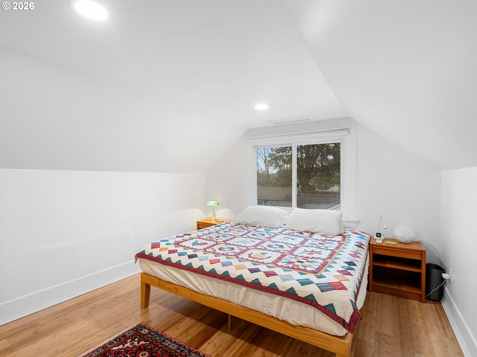 1310 Northeast 70th Avenue Portland, OR 97213 - Photo 12 of 30 a bedroom with a bed and a window