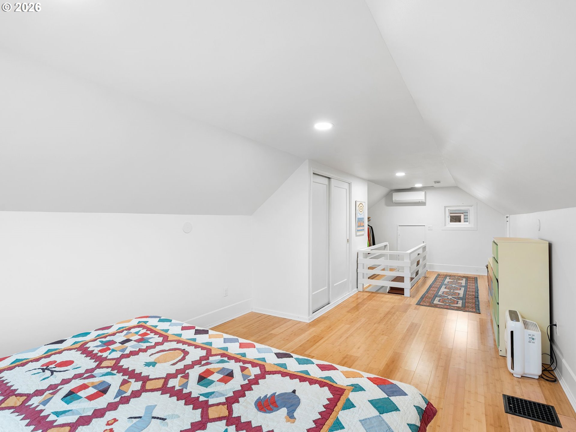 1310 Northeast 70th Avenue Portland, OR 97213 - Photo 13 of 30 a bedroom with a bed and a lamp on dresser
