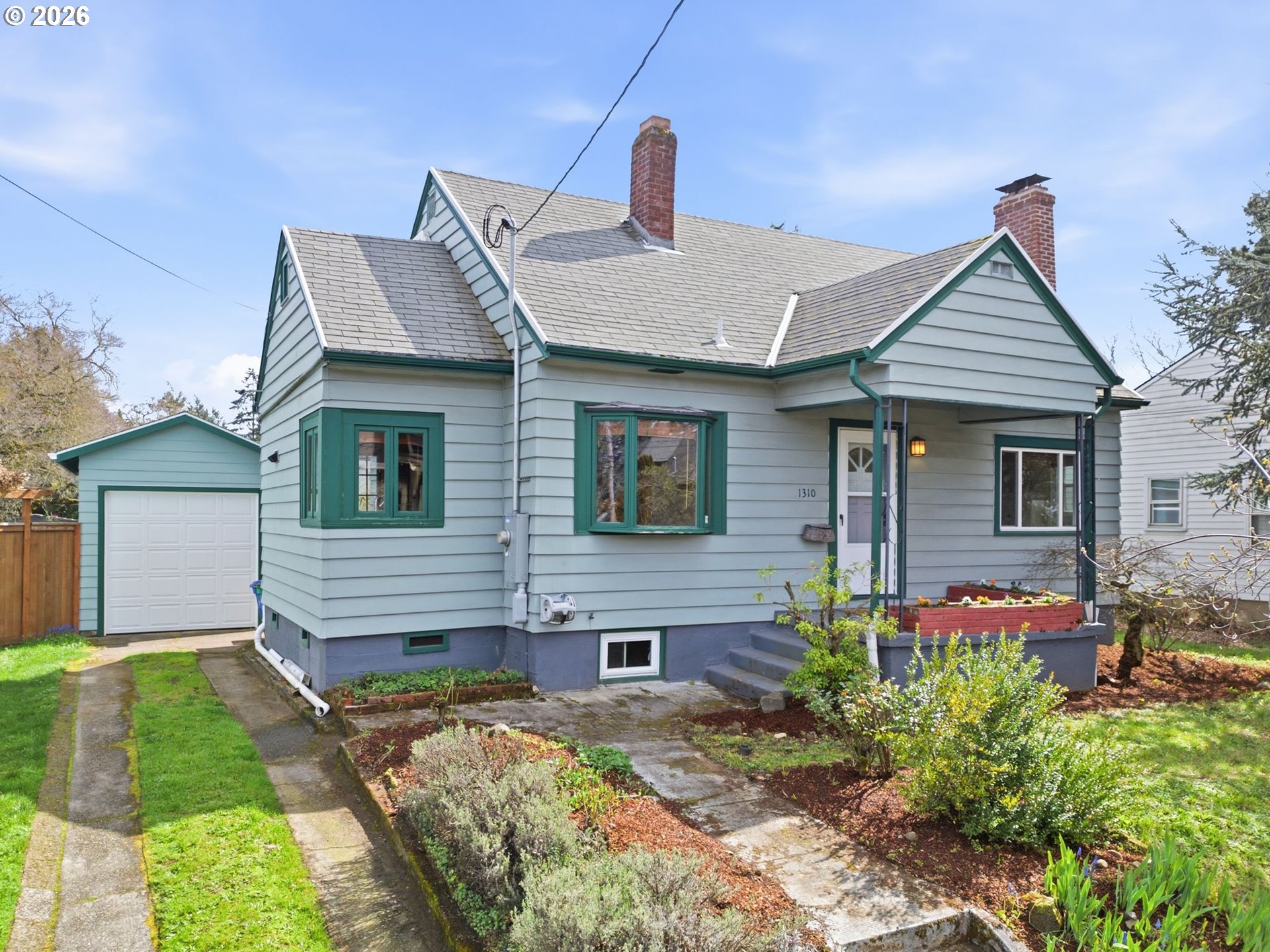 1310 Northeast 70th Avenue Portland, OR 97213 - Photo 2 of 30 a front view of a house with garden