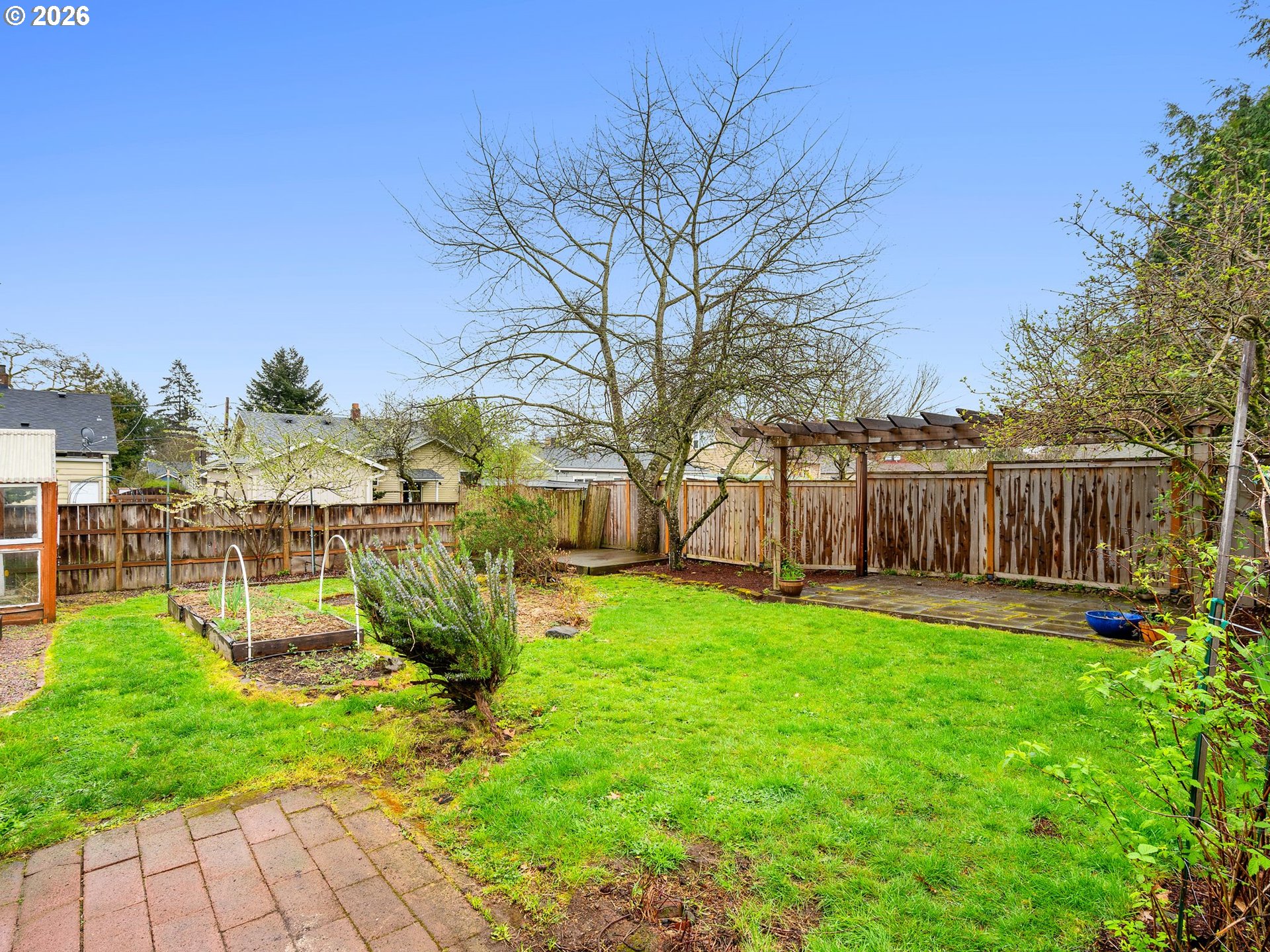 1310 Northeast 70th Avenue Portland, OR 97213 - Photo 22 of 30 a view of a yard with large trees