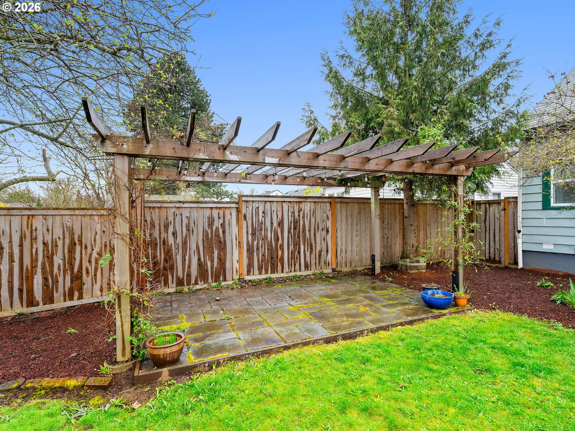 1310 Northeast 70th Avenue Portland, OR 97213 - Photo 24 of 30 a backyard of a house with barbeque oven table and chairs