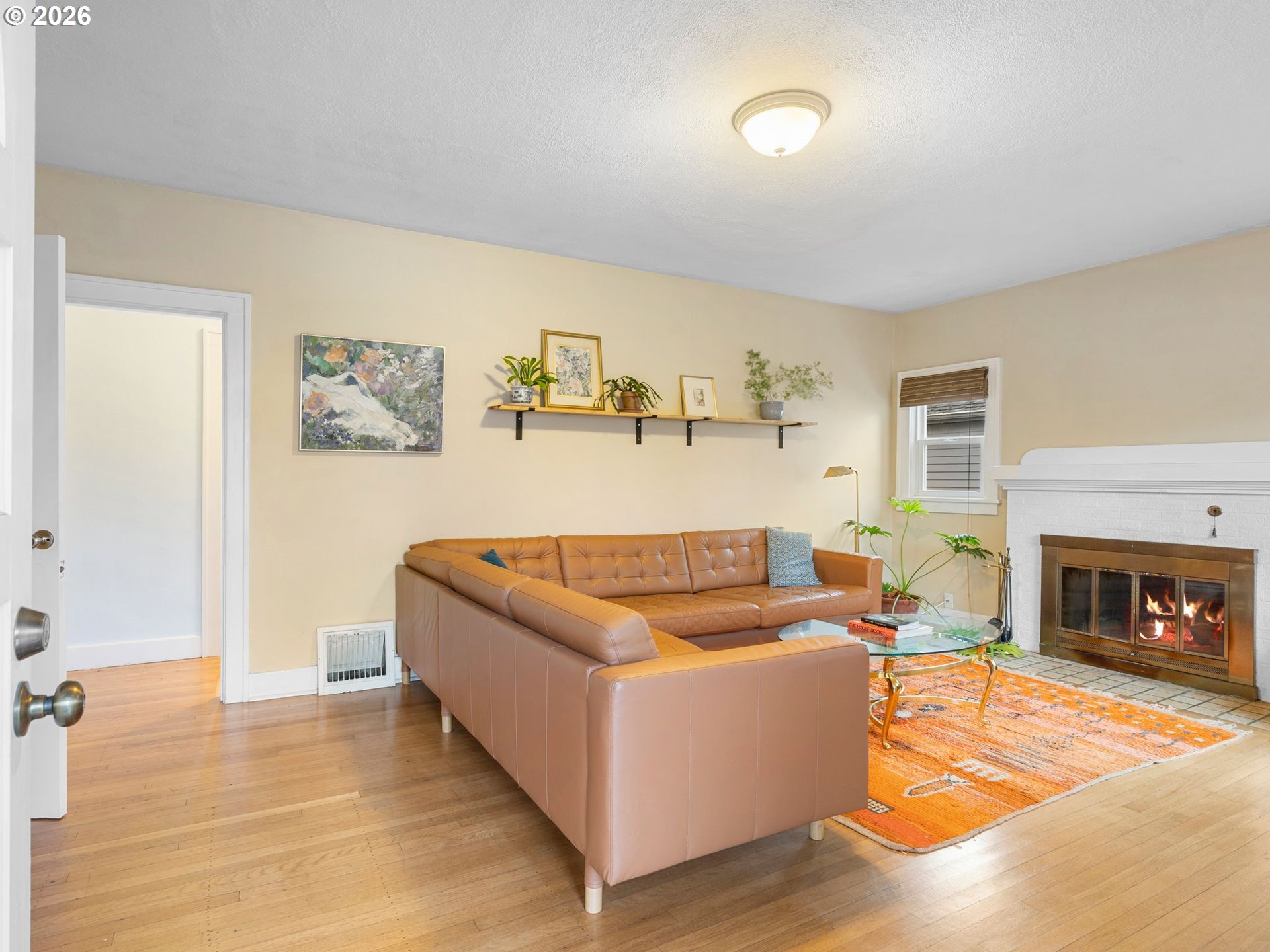 1310 Northeast 70th Avenue Portland, OR 97213 - Photo 3 of 30 a living room with furniture and a fireplace