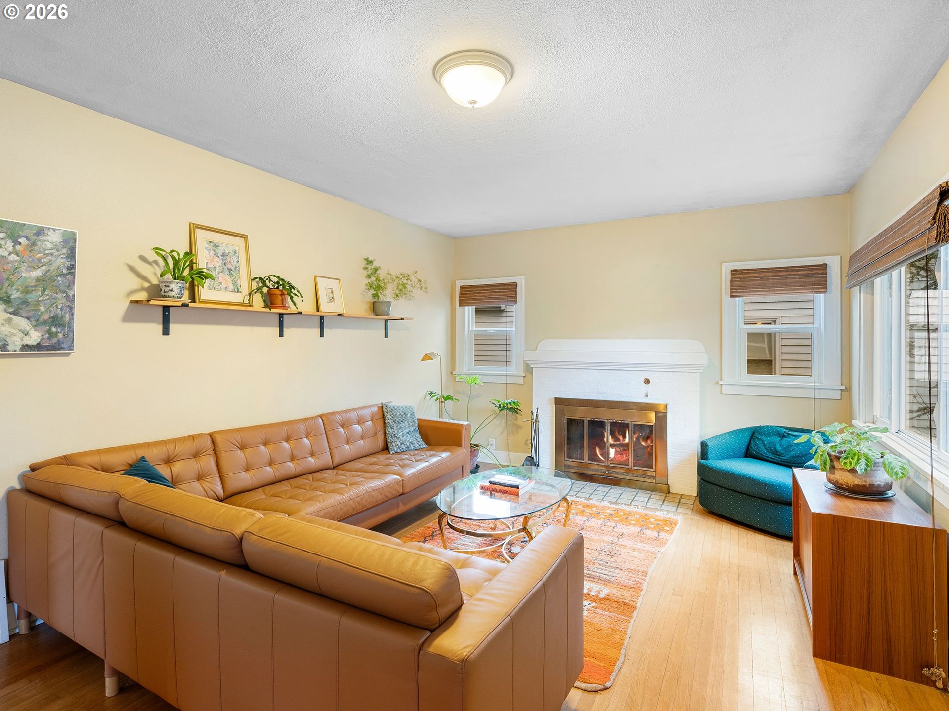 1310 Northeast 70th Avenue Portland, OR 97213 - Photo 4 of 30 a living room with furniture and a fireplace
