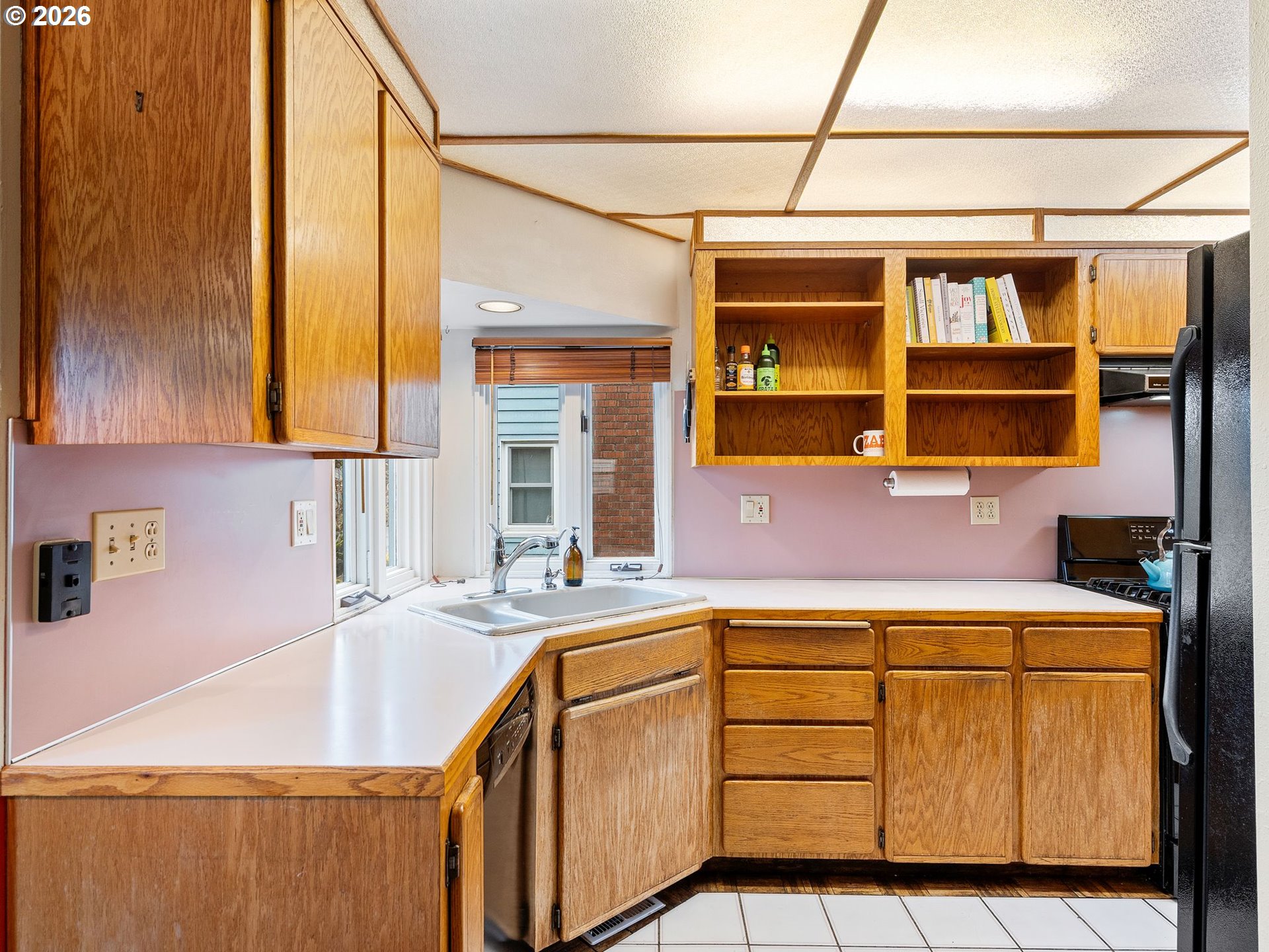 1310 Northeast 70th Avenue Portland, OR 97213 - Photo 9 of 30 a kitchen with a sink cabinets and a window