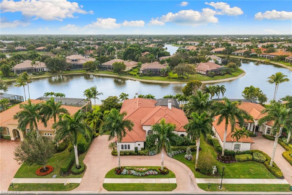 7837 Classics Drive Naples, FL 34113 - Photo 44 of 50 Aerial perspective of suburban area featuring a large body of water