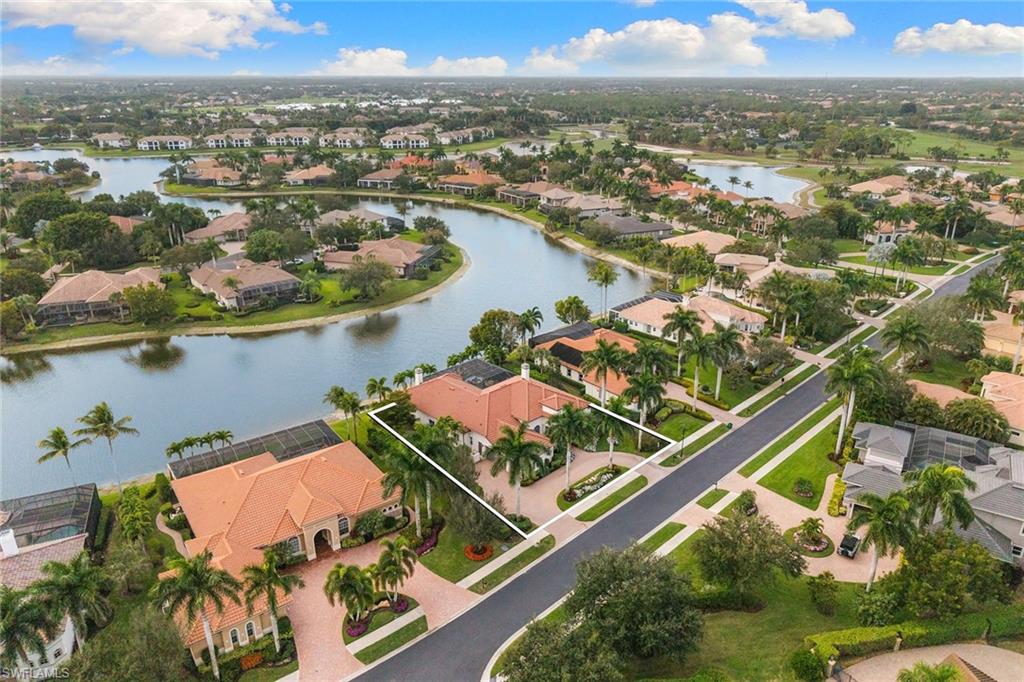 7837 Classics Drive Naples, FL 34113 - Photo 45 of 50 Aerial view of residential area with a large body of water