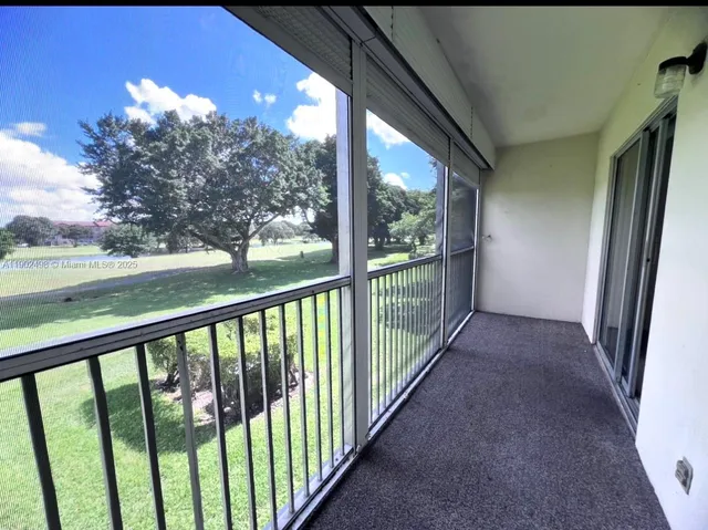 a view of a porch with wooden floor and outdoor space