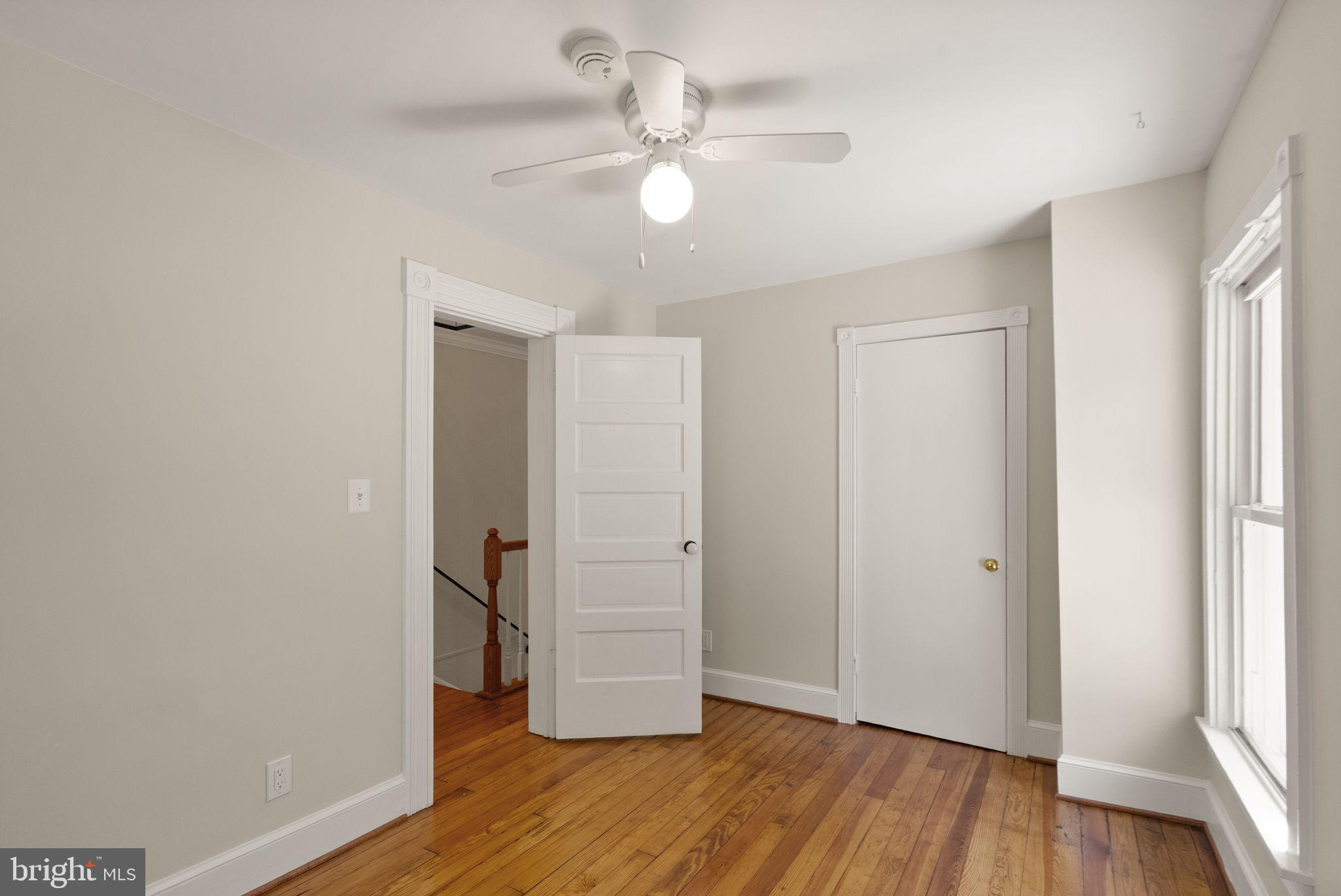 37151 Branchriver Road Purcellville, VA 20132 - Photo 39 of 63 wooden floor in an empty room with a window