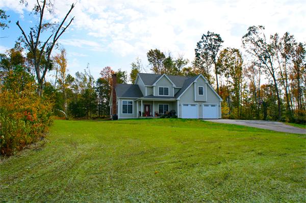 69 Carpenter Road Monson, MA 01057 - Photo 16 of 16 a front view of house with yard and green space