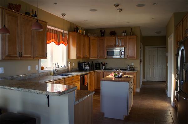 69 Carpenter Road Monson, MA 01057 - Photo 5 of 16 a kitchen with stainless steel appliances granite countertop a refrigerator a sink dishwasher a stove and a countertops with wooden floor