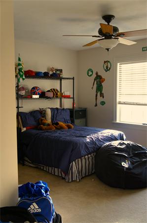 69 Carpenter Road Monson, MA 01057 - Photo 9 of 16 a bed sitting in a bedroom next to a window