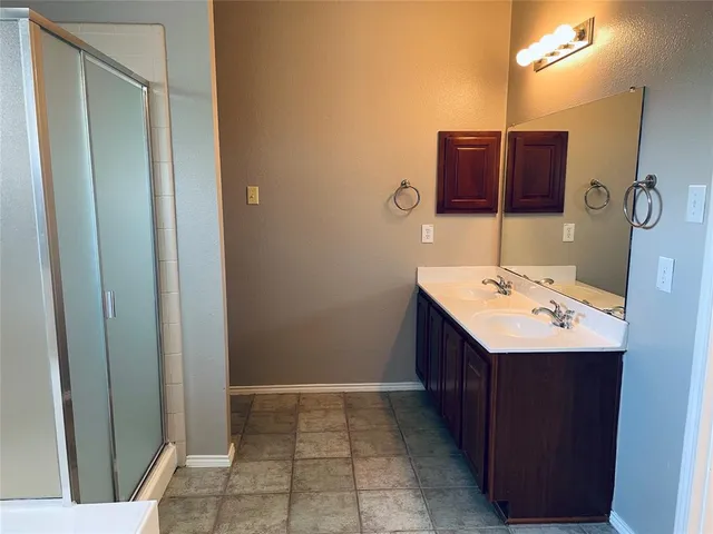 a bathroom with a sink and mirror