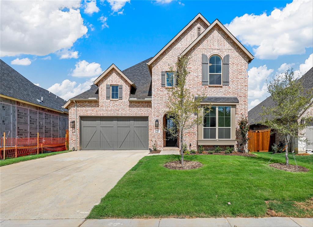 1709 Open Range Drive Mansfield, TX 76063 - Photo 1 of 1 a front view of a house with a yard and garage
