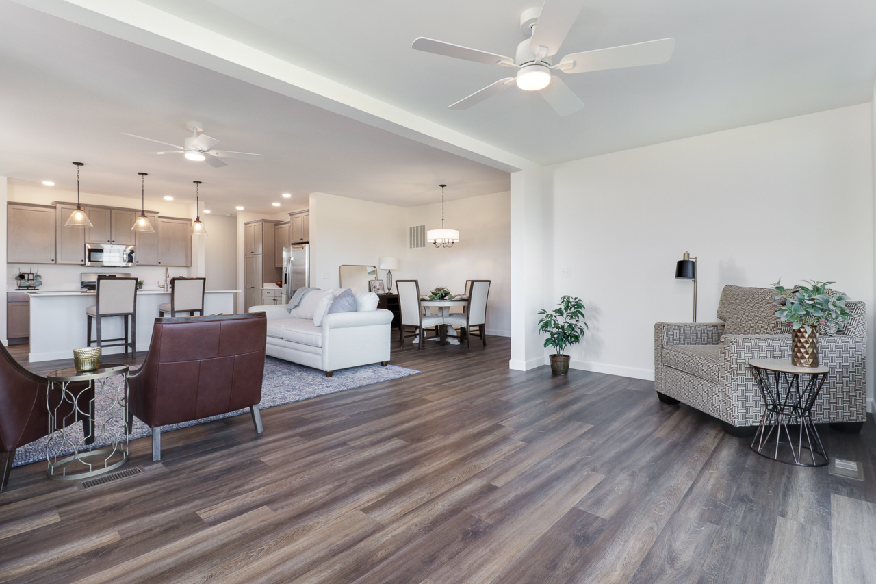 1332 Monterey Pine Drive Normal, IL 61761 - Photo 19 of 33 a living room with furniture and a wooden floor