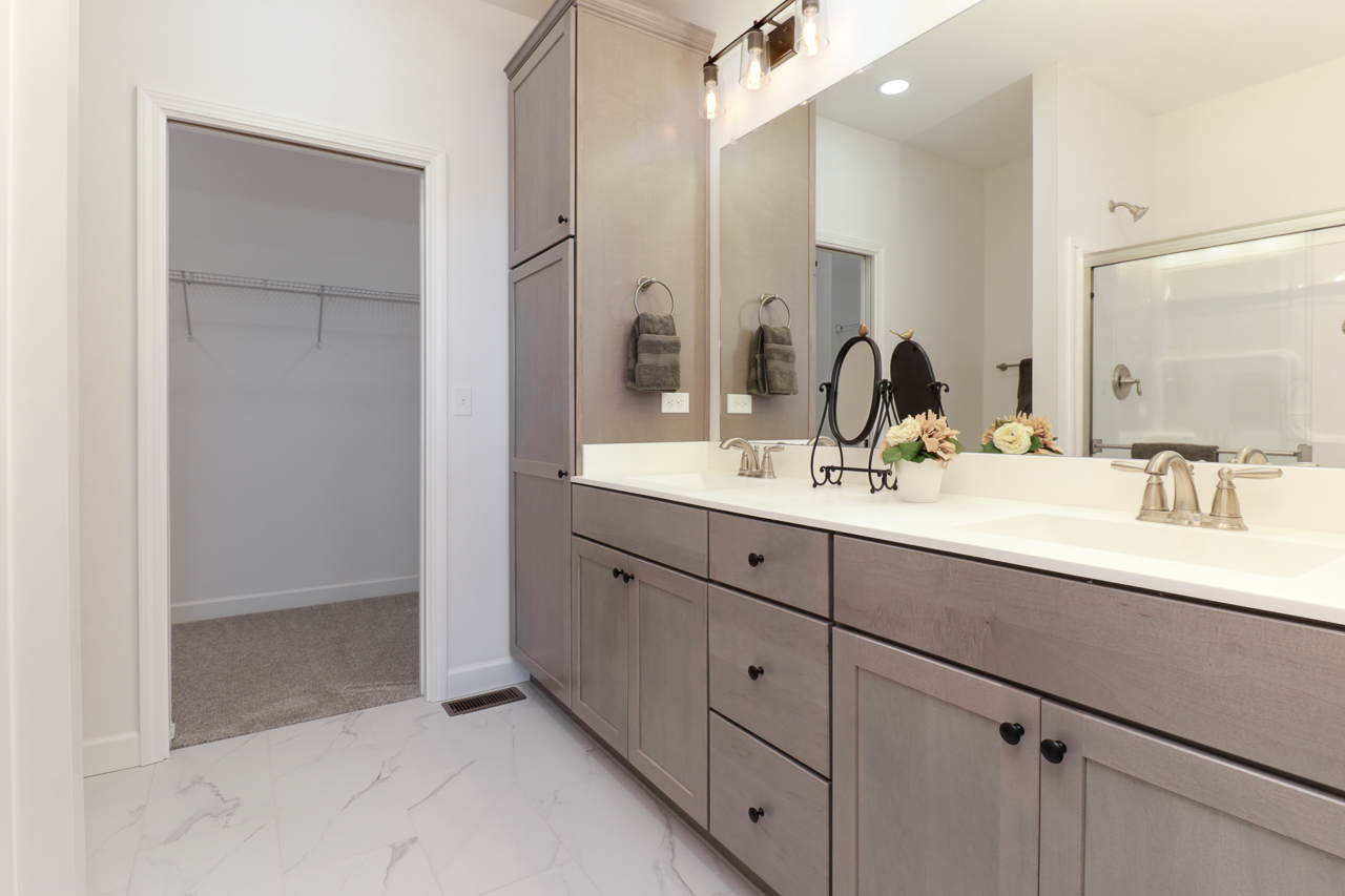 1332 Monterey Pine Drive Normal, IL 61761 - Photo 22 of 33 a bathroom with double sink and a mirror