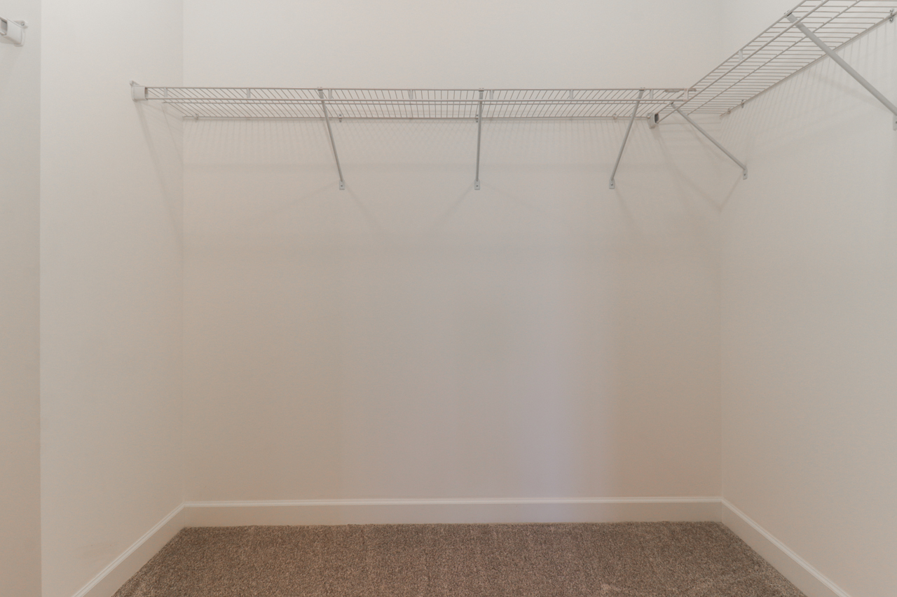 1332 Monterey Pine Drive Normal, IL 61761 - Photo 24 of 33 a view of a room with racks on the wall