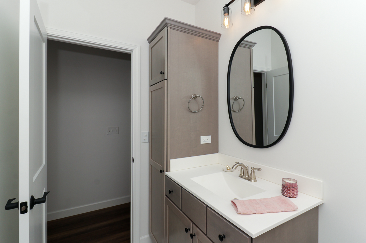 1332 Monterey Pine Drive Normal, IL 61761 - Photo 28 of 33 a bathroom with a sink and a mirror