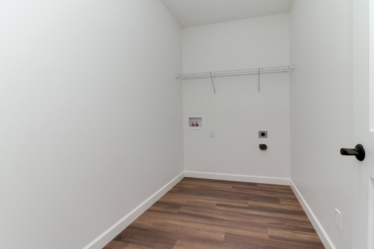 1332 Monterey Pine Drive Normal, IL 61761 - Photo 3 of 33 a view of a room with wooden floor