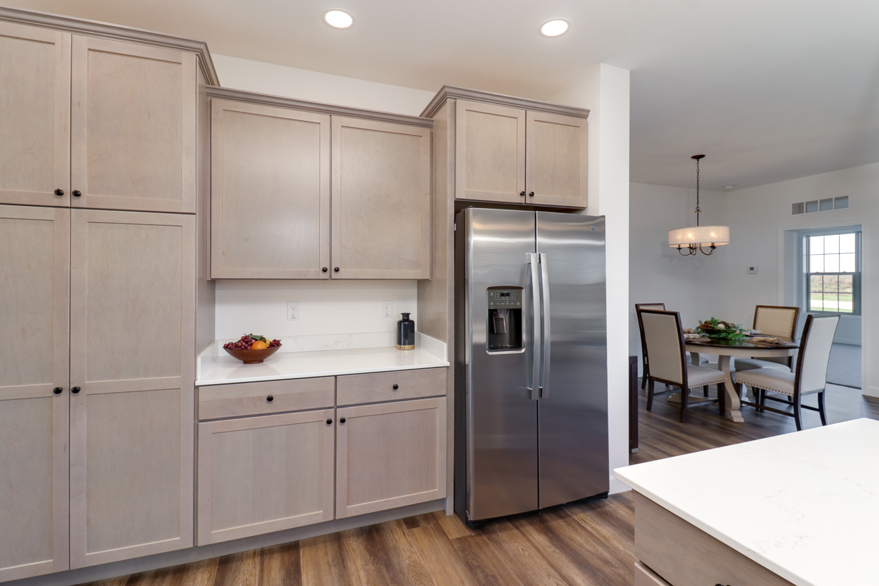 1332 Monterey Pine Drive Normal, IL 61761 - Photo 8 of 33 a kitchen with cabinets and wooden floor