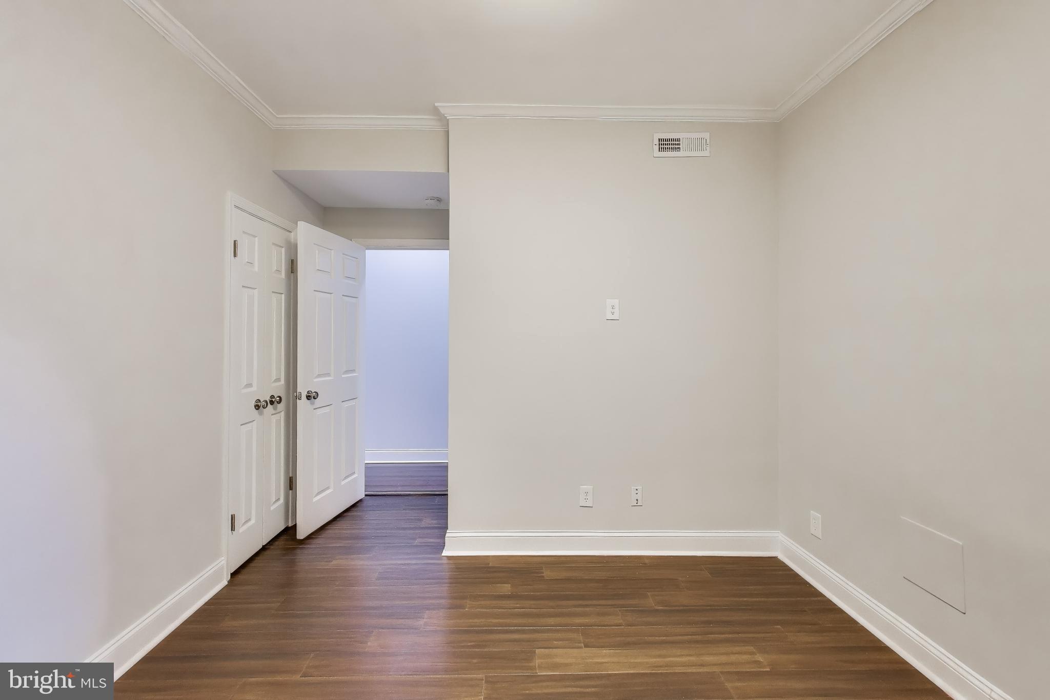 1724 21st Street Northwest, Unit 3 Washington, DC 20009 - Photo 13 of 17 a view of an empty room with wooden floor