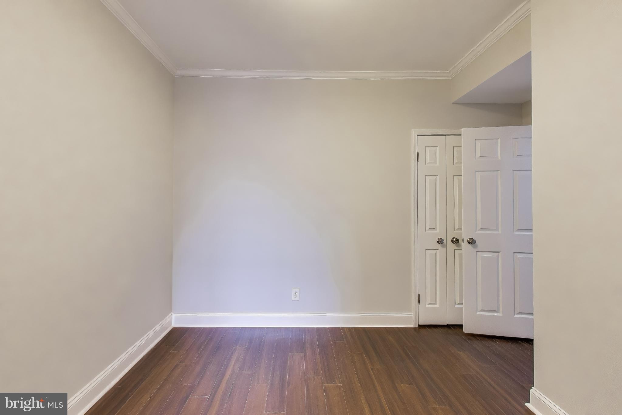 1724 21st Street Northwest, Unit 3 Washington, DC 20009 - Photo 14 of 17 a view of an empty room and wooden floor