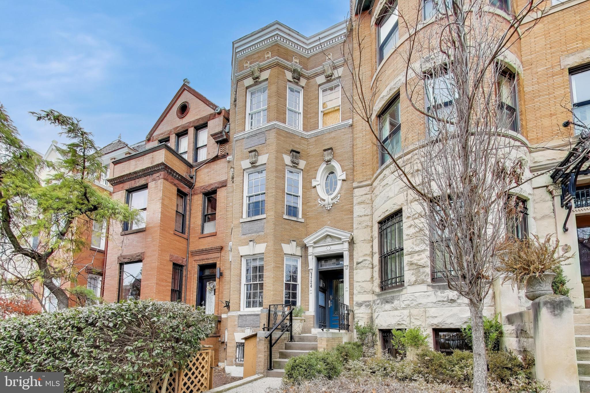 1724 21st Street Northwest, Unit 3 Washington, DC 20009 - Photo 16 of 17 a view of a white building among the street with plants