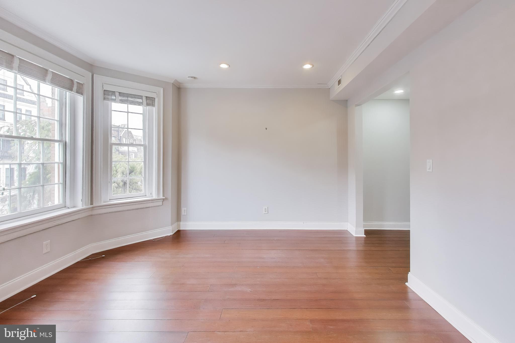 1724 21st Street Northwest, Unit 3 Washington, DC 20009 - Photo 7 of 17 wooden floor in an empty room with a window