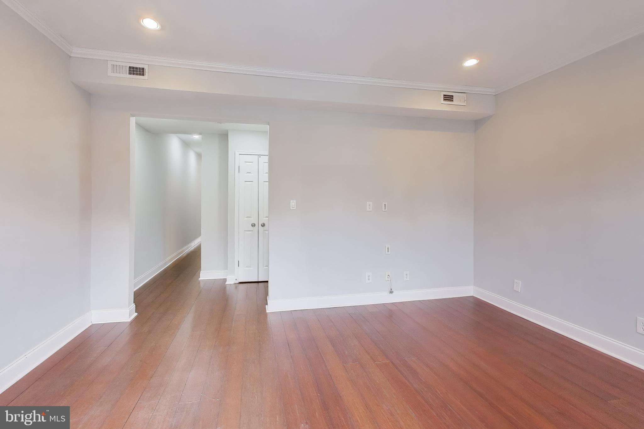 1724 21st Street Northwest, Unit 3 Washington, DC 20009 - Photo 8 of 17 a view of a room with wooden floors and led lights