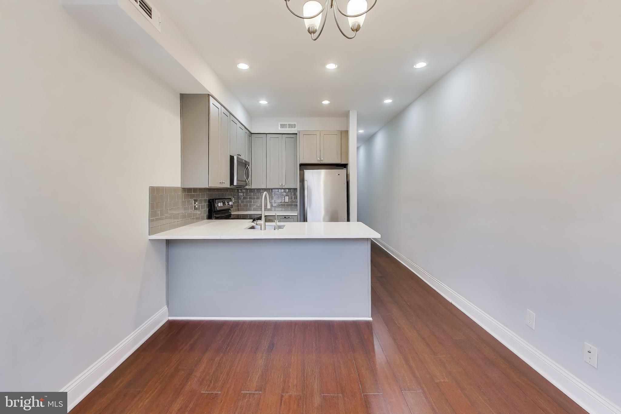 1724 21st Street Northwest, Unit 3 Washington, DC 20009 - Photo 10 of 17 a view of kitchen with wooden floor