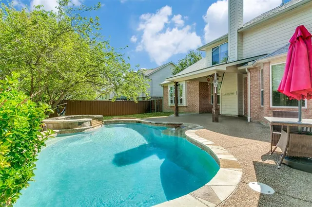 a view of a house with swimming pool