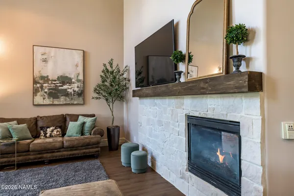 a bedroom with a bed and a fireplace