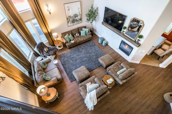a kitchen with stainless steel appliances kitchen island granite countertop a stove and a large countertops with wooden floor