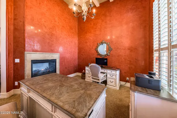 a kitchen with granite countertop stainless steel appliances and wooden floor
