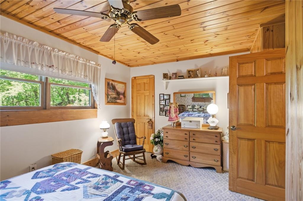 46 Spartan Lane Rabun Gap, GA 30568 - Photo 38 of 89 a bedroom with furniture and a window