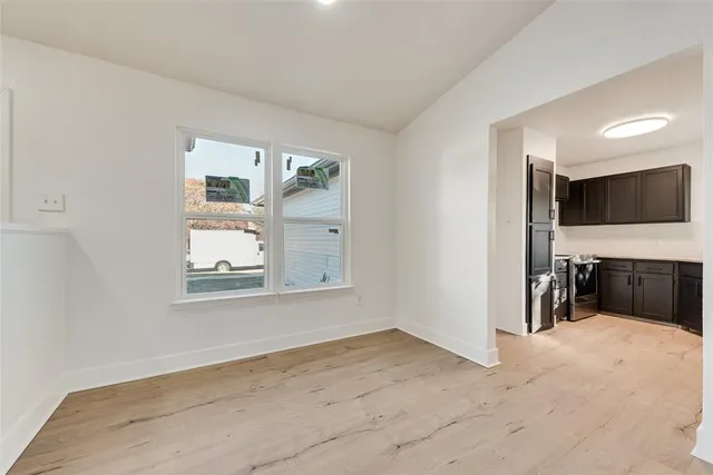 a view of a livingroom with furniture and a flat screen tv