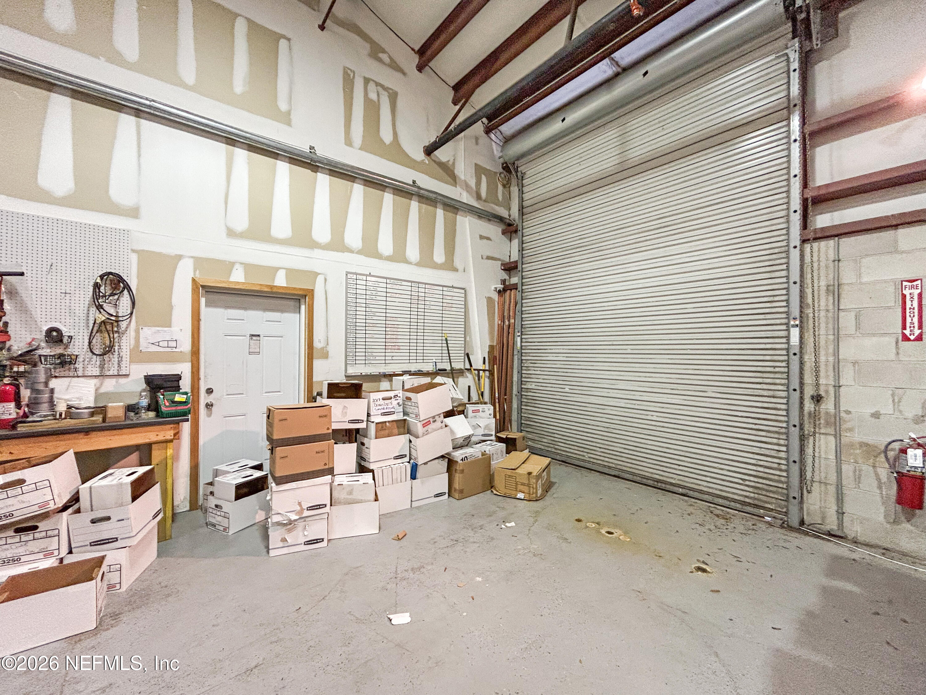 a view of a patio with table and chairs and potted plants