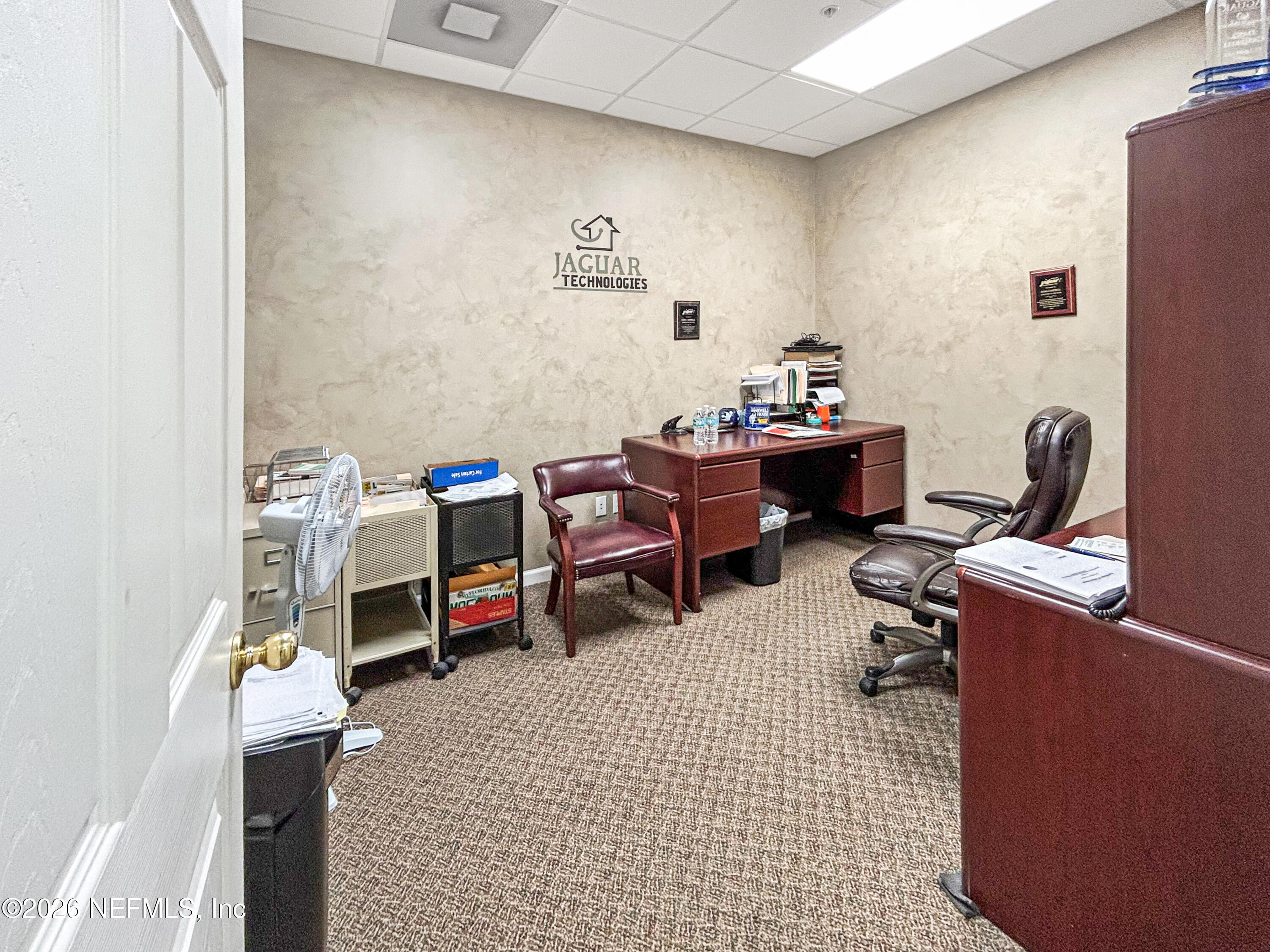 1635 Farm Way, Unit 402 Middleburg, FL 32068 - Photo 13 of 20 a room with a baby crib and a couch