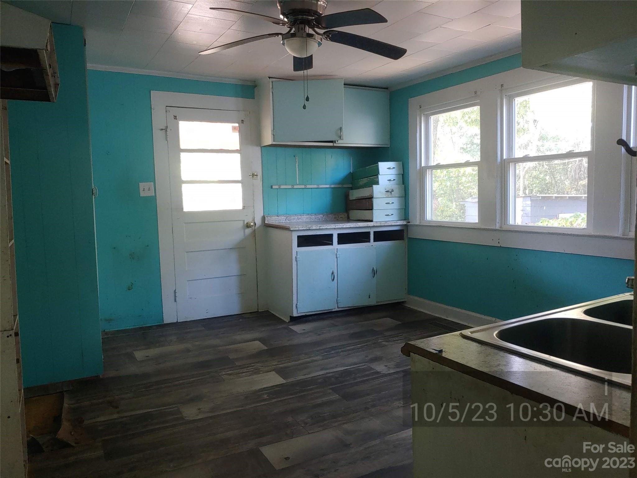 403 Vance Avenue Salisbury, NC 28144 - Photo 3 of 14 a kitchen with kitchen island a sink stainless steel appliances and window