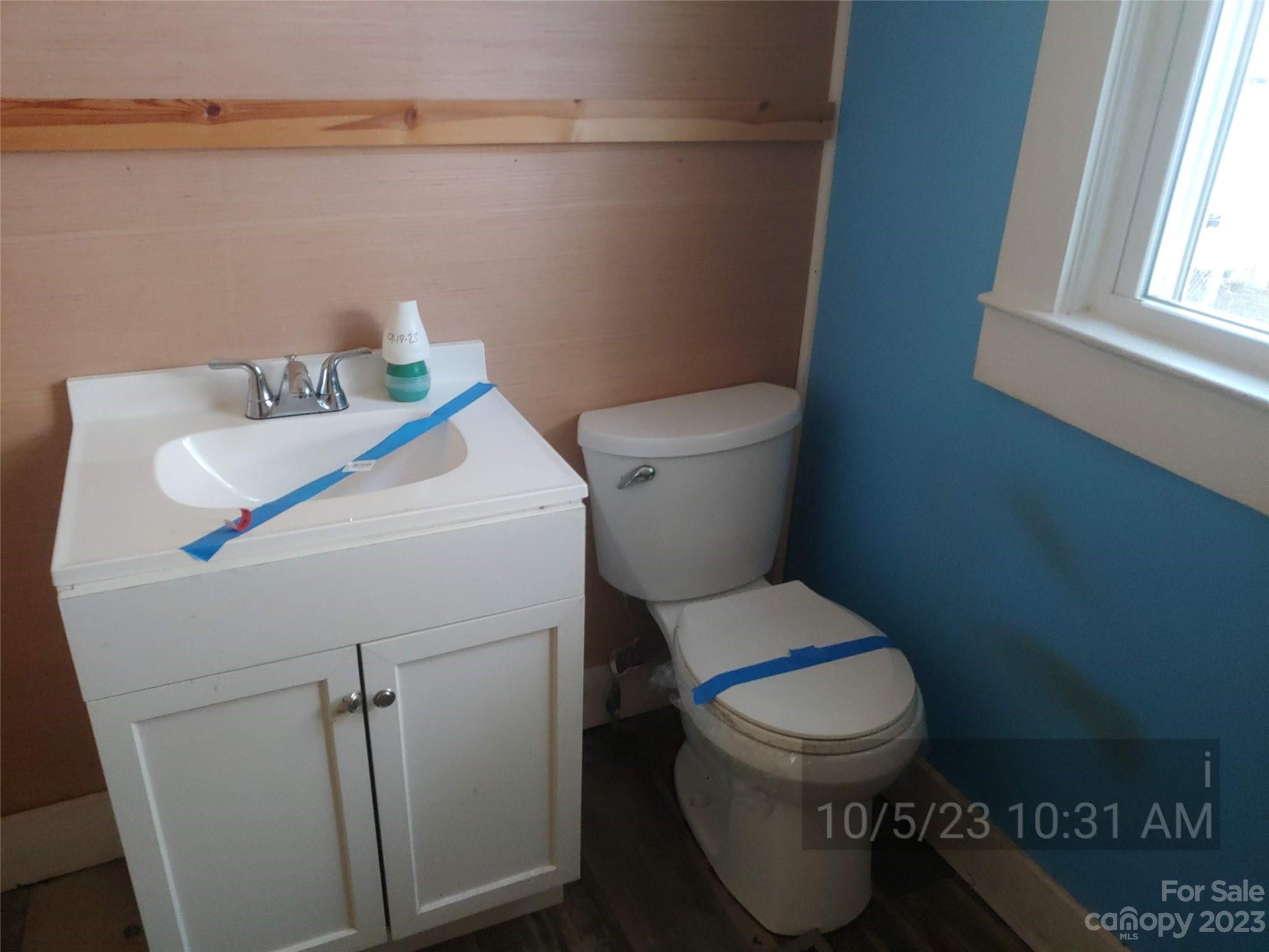 403 Vance Avenue Salisbury, NC 28144 - Photo 10 of 14 a white toilet sitting next to a bathroom sink