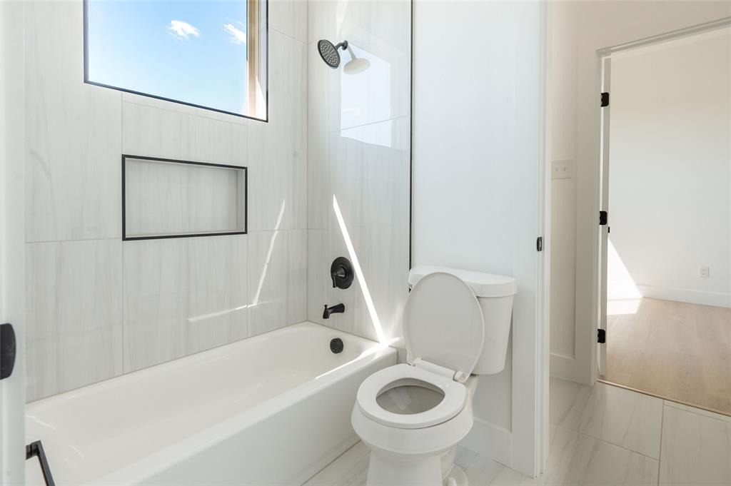 592 Highview Court Godley, TX 76044 - Photo 16 of 21 Convenient Jack-and-Jill bathroom connecting two secondary bedrooms