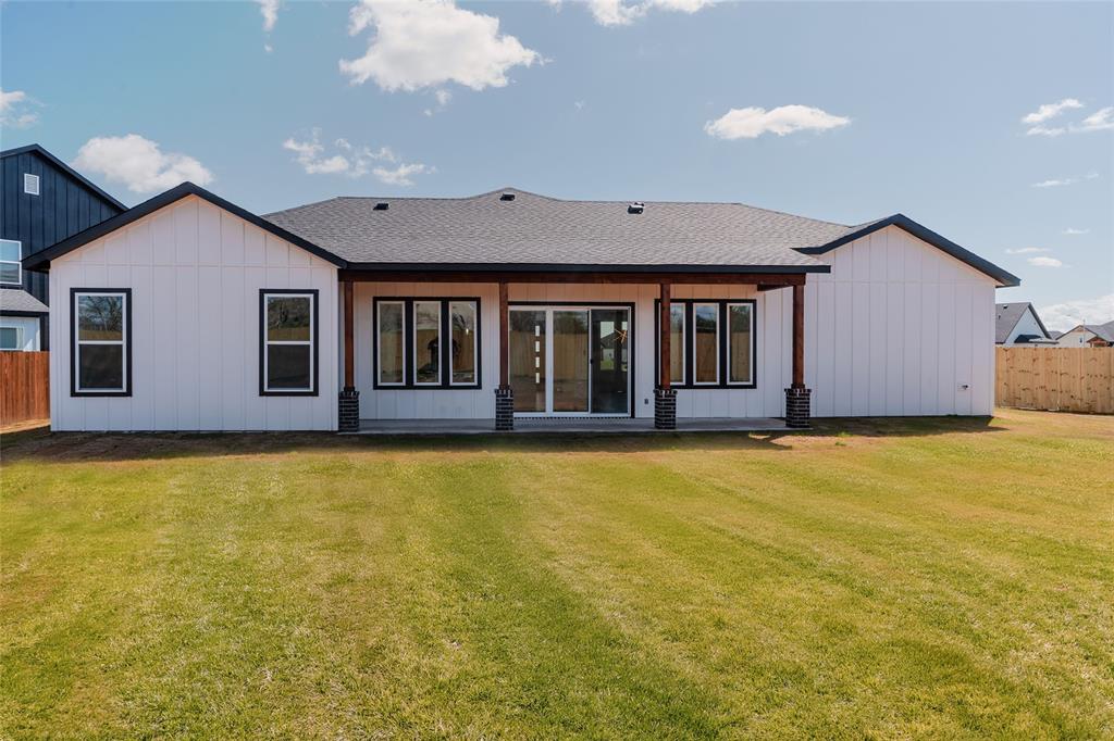 592 Highview Court Godley, TX 76044 - Photo 18 of 21 Back of house featuring a extended patio