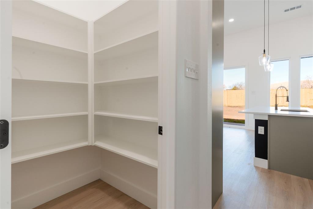 592 Highview Court Godley, TX 76044 - Photo 6 of 21 Large walk-in pantry with built-in shelving.