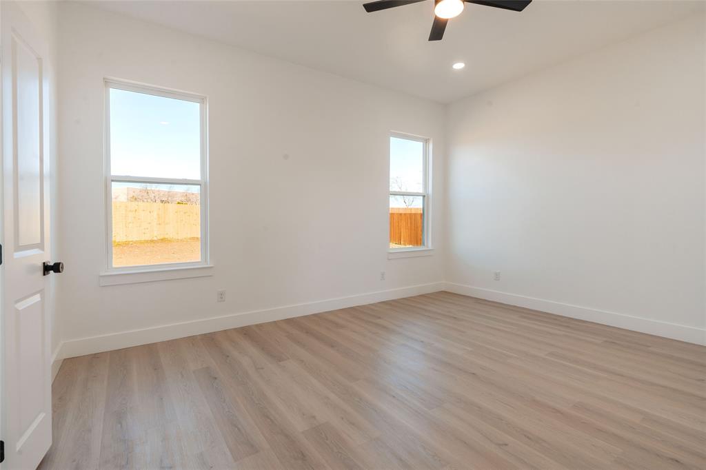 592 Highview Court Godley, TX 76044 - Photo 7 of 21 Private split-bedroom design with a spacious primary suite, high ceilings, and beautiful natural light.