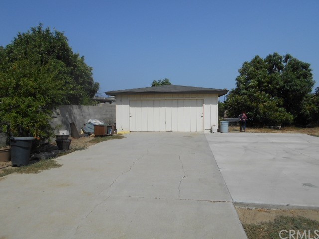 811 Riverside Rialto, CA 92376 - Photo 8 of 25 a view of garage and a car parked
