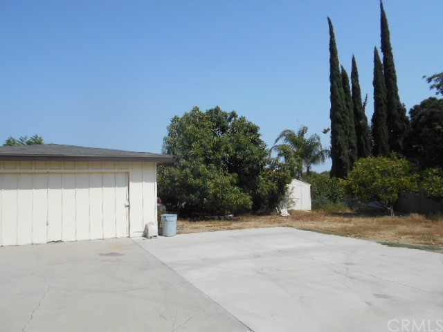 811 Riverside Rialto, CA 92376 - Photo 9 of 25 a view of a house with palm trees