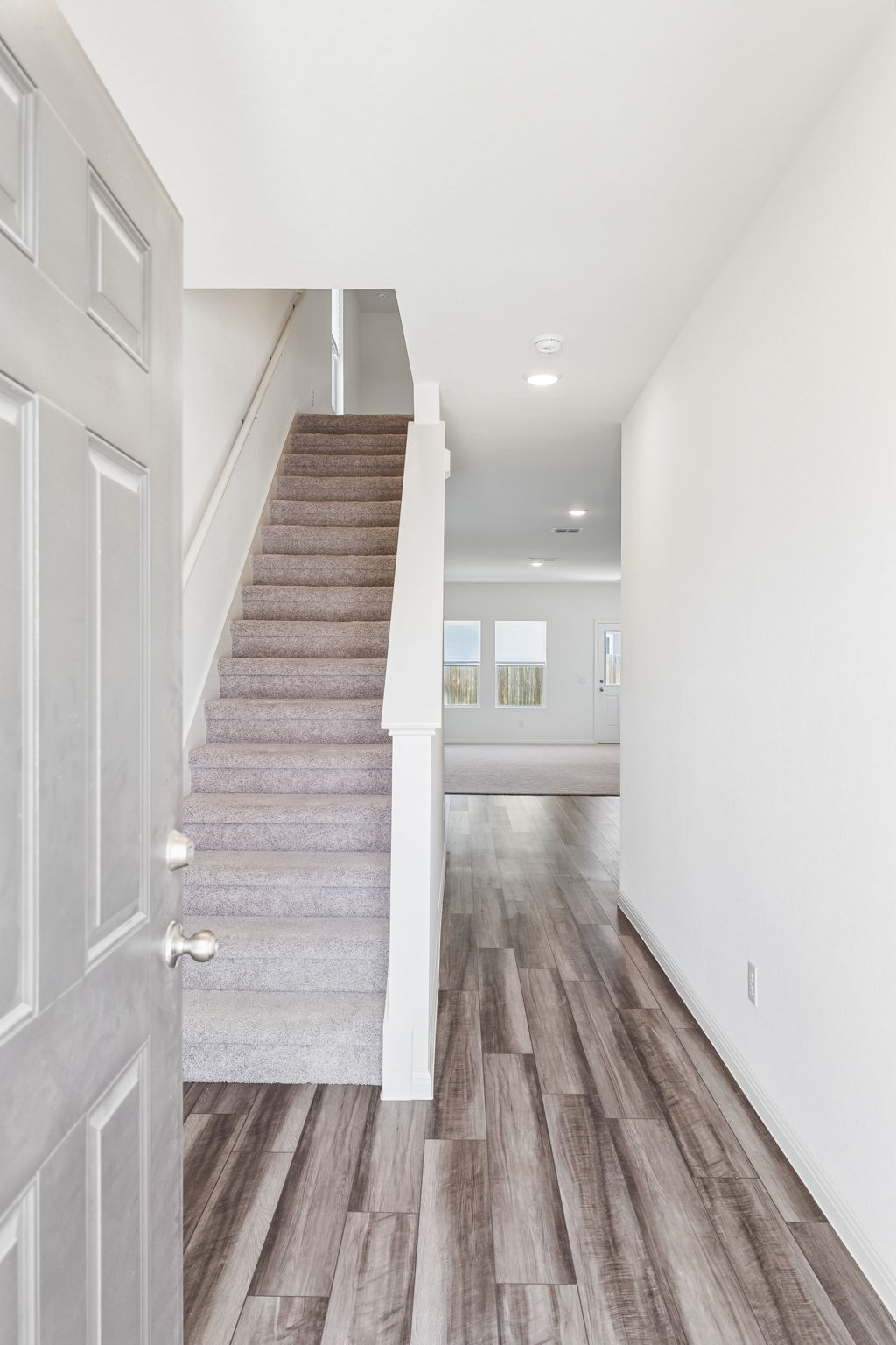550 Thistle Lane Maxwell, TX 78656 - Photo 5 of 29 Stairway featuring wood finished floors and recessed lighting