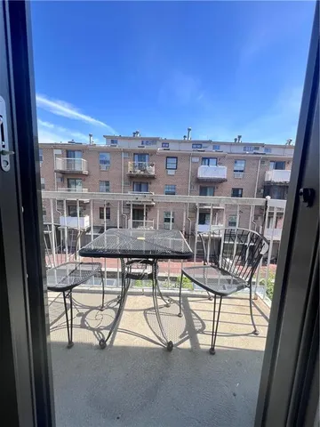 a view of a balcony with chairs